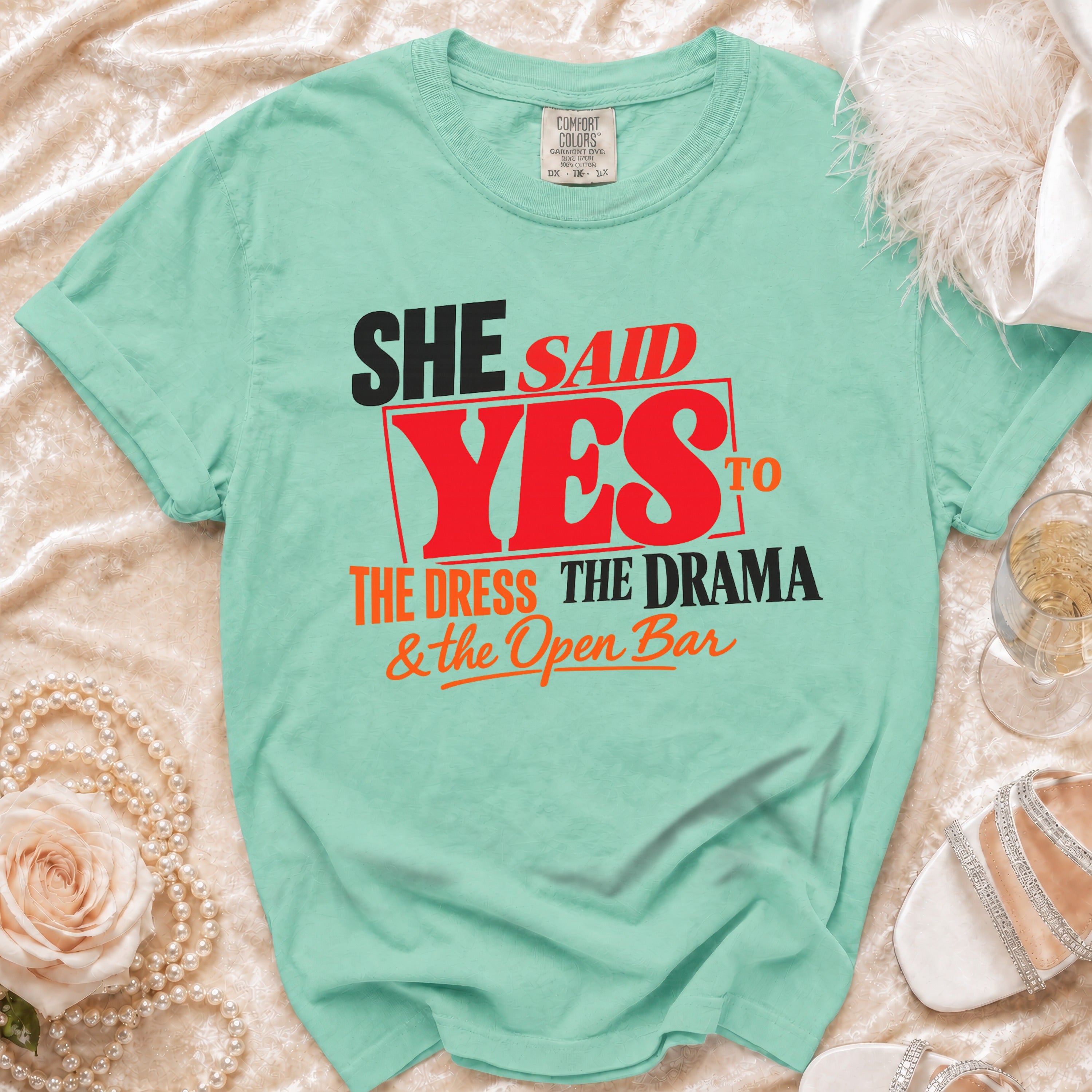 Aqua t-shirt with text: "She Said Yes to the Dress, the Drama & the Open Bar."