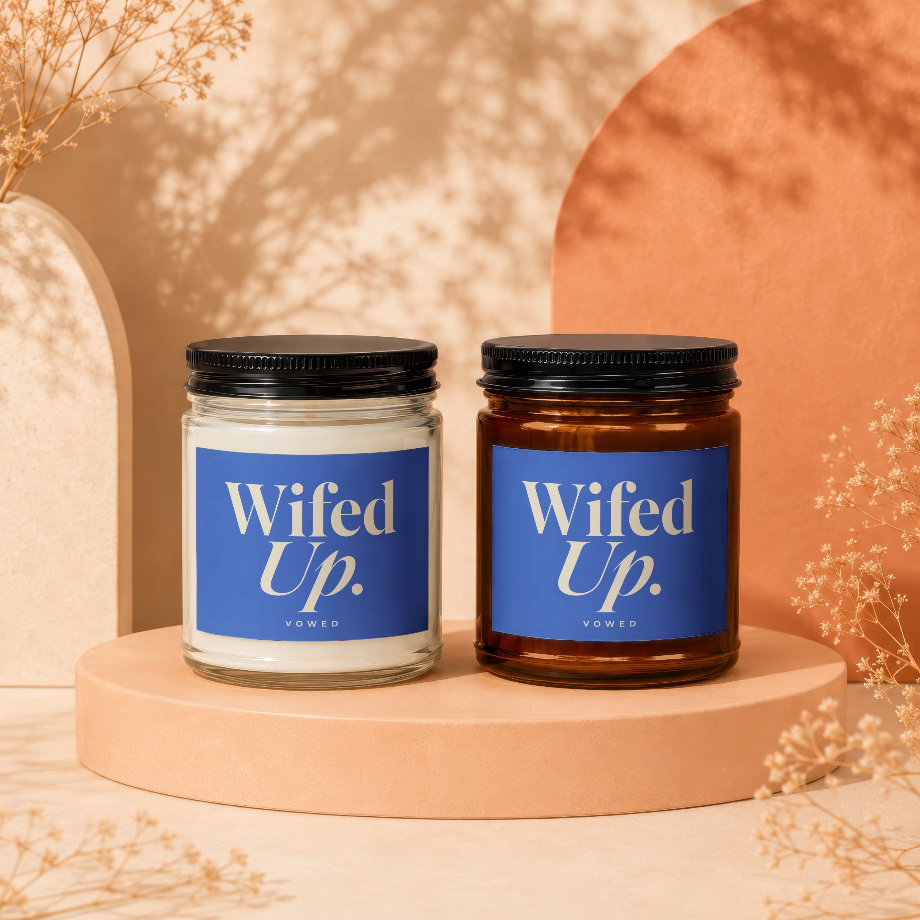 Two candles with "Wifed Up." labels and "VOWED" text sit on display pedestals.