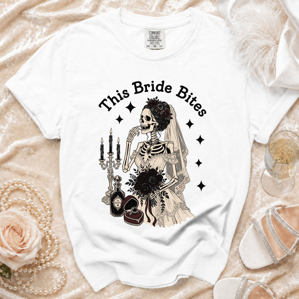 White t-shirt with "This Bride Bites" text and a skeleton bride graphic.