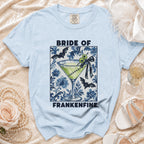 Light blue t-shirt with "Bride of Frankenfine" text and a cocktail graphic.