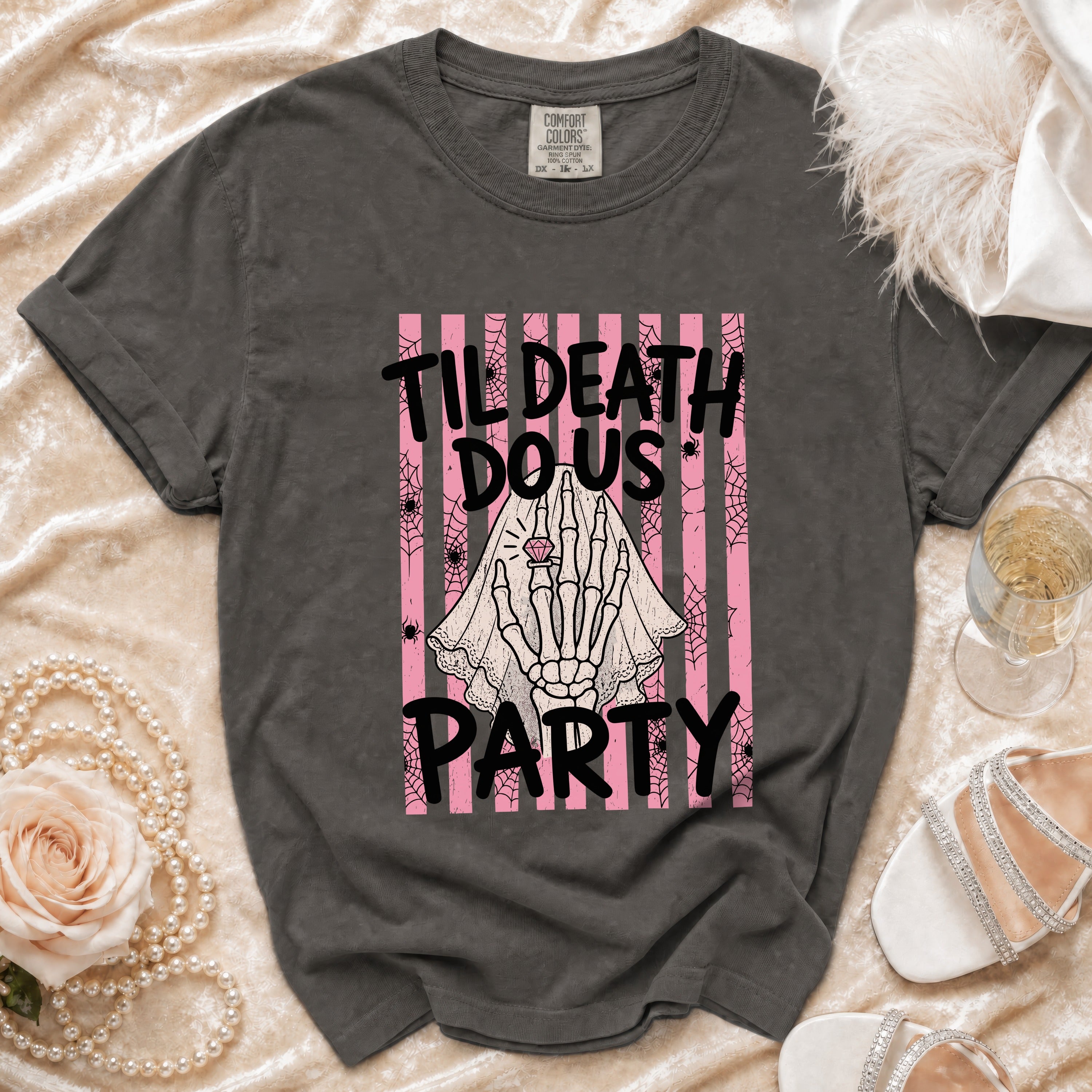 Dark gray t-shirt with "Til Death Do Us Party" text and skeleton hand graphic.