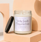 Glass candle with "To the family I married into" sentiment and "Vowed" branding.