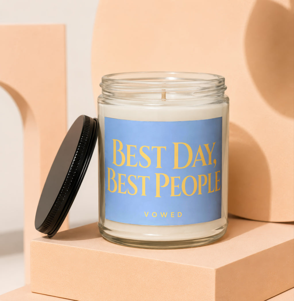 Glass candle with blue label reading "BEST DAY, BEST PEOPLE VOWED".