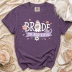 Purple t-shirt with "Bride to Boo-tiful" text and a ghost bride graphic.