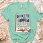 Mint green t-shirt with "Mother of the Groom Wedding Weekend Social Club" graphic.