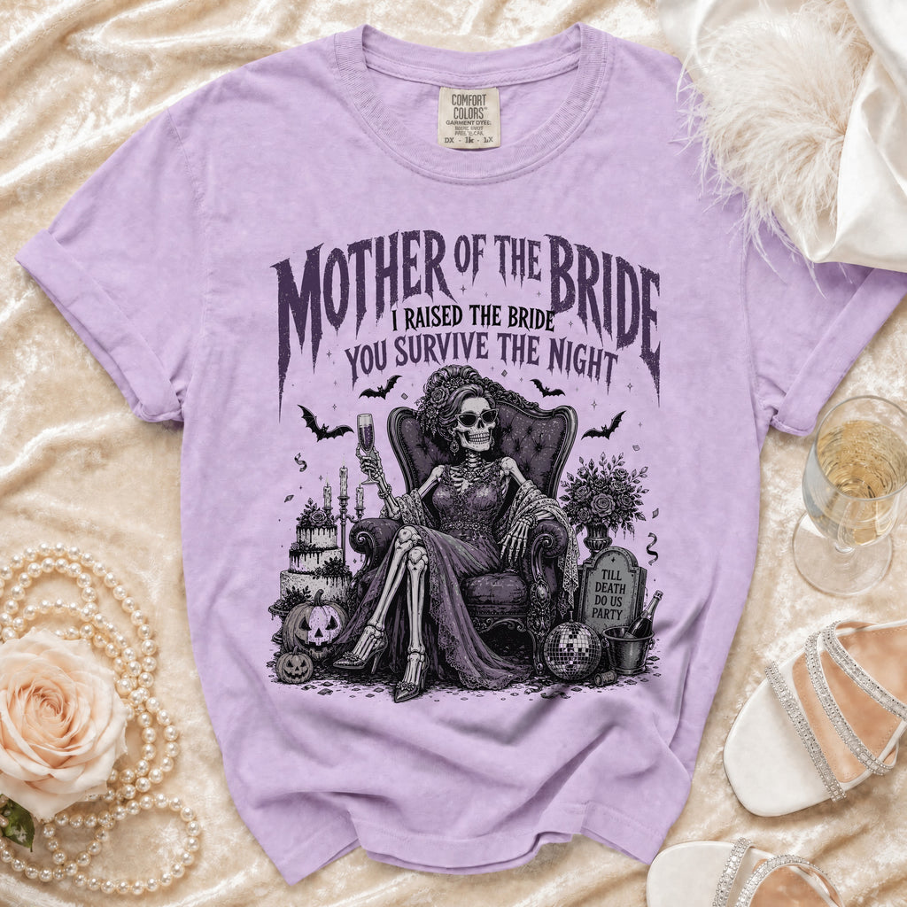 Purple t-shirt with skeleton bride saying "Mother of the Bride I Raised the Bride You Survive the Night".
