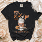 Black t-shirt with "Mother of the Bride Club" graphic, coffee cup, pumpkin, and witch hat.