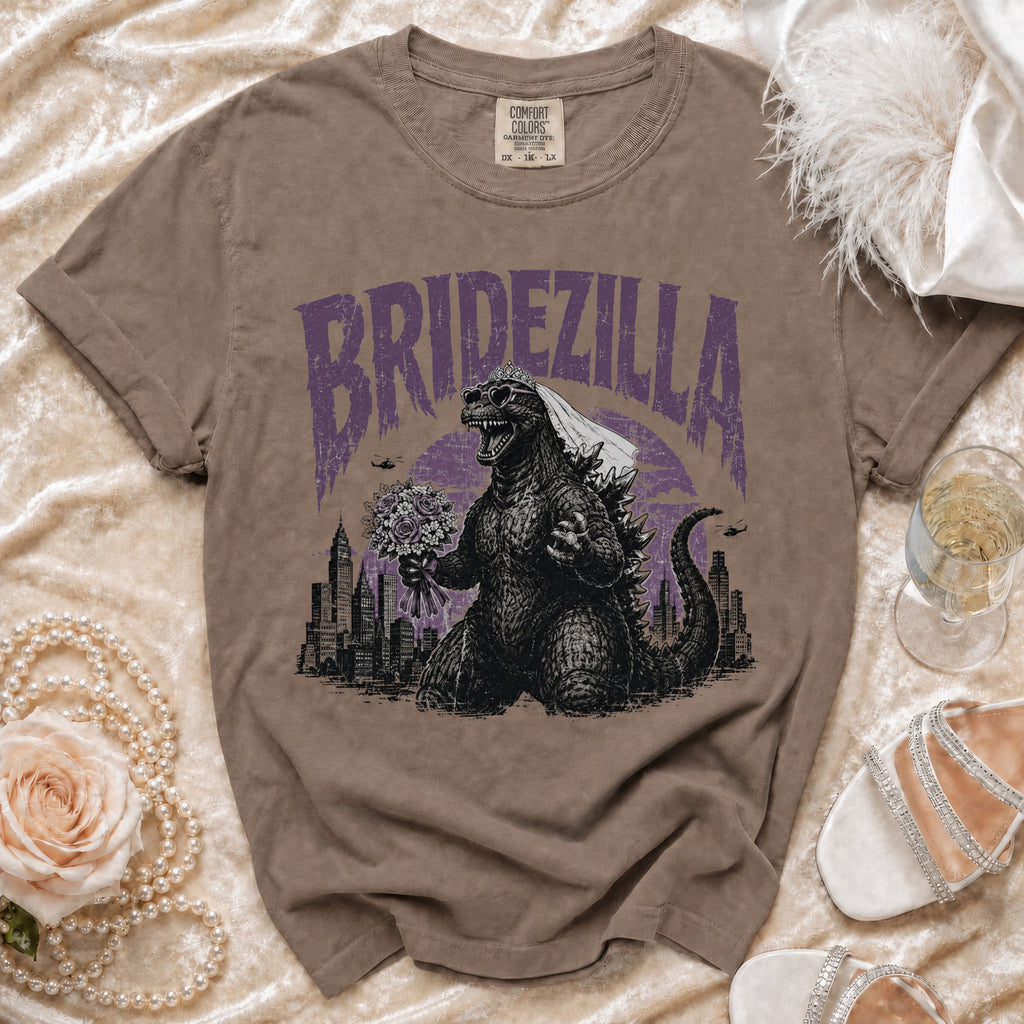 Godzilla wearing a veil and heart sunglasses holding a bouquet with "BRIDZELLA" text.