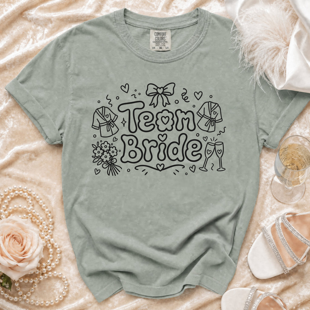 Green t-shirt with "Team Bride" text and illustrated bridal party attire.