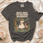 Dark grey t-shirt with "HOLY SHIT I'M GETTING MARRIED" text and wedding graphic.