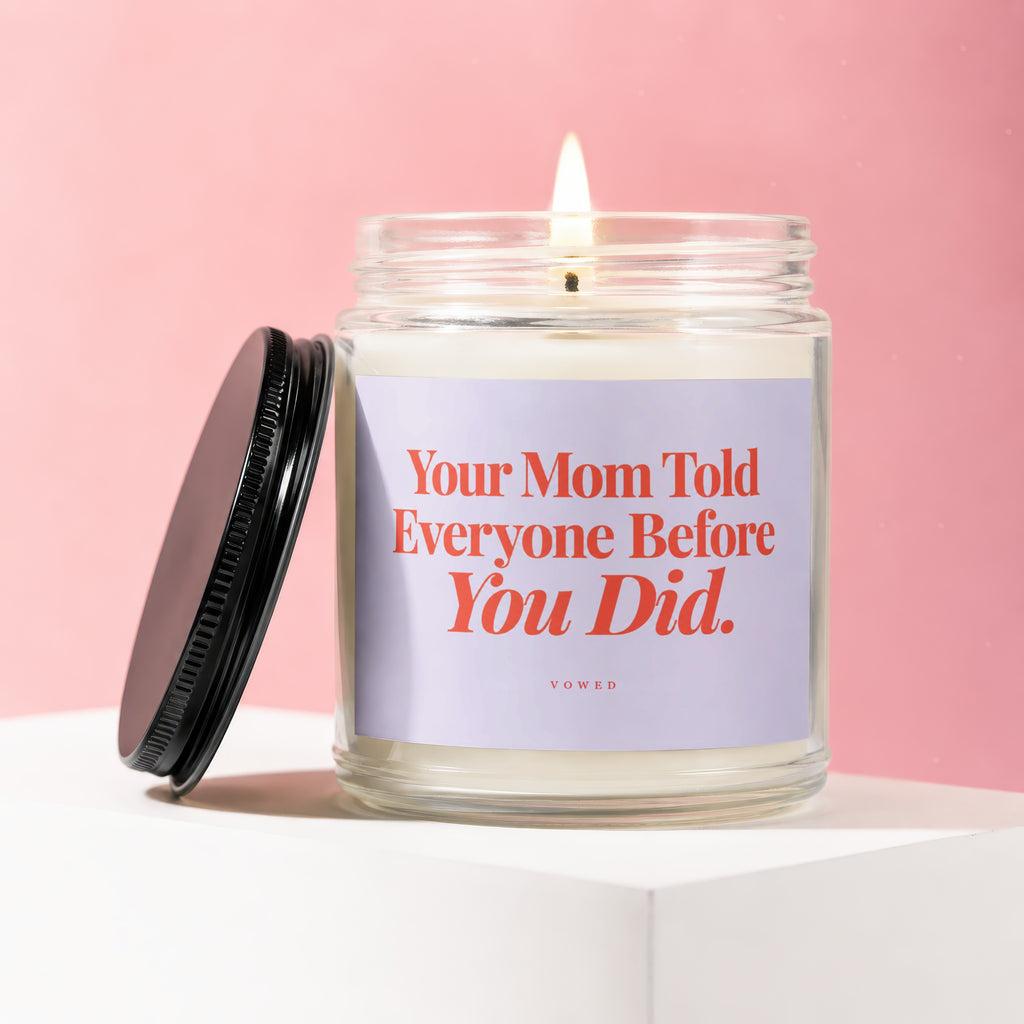 Glass candle with lid off, featuring text "Your Mom Told Everyone Before You Did."