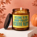 Amber jar candle with yellow label reading: Welcome to the Wedding Party.