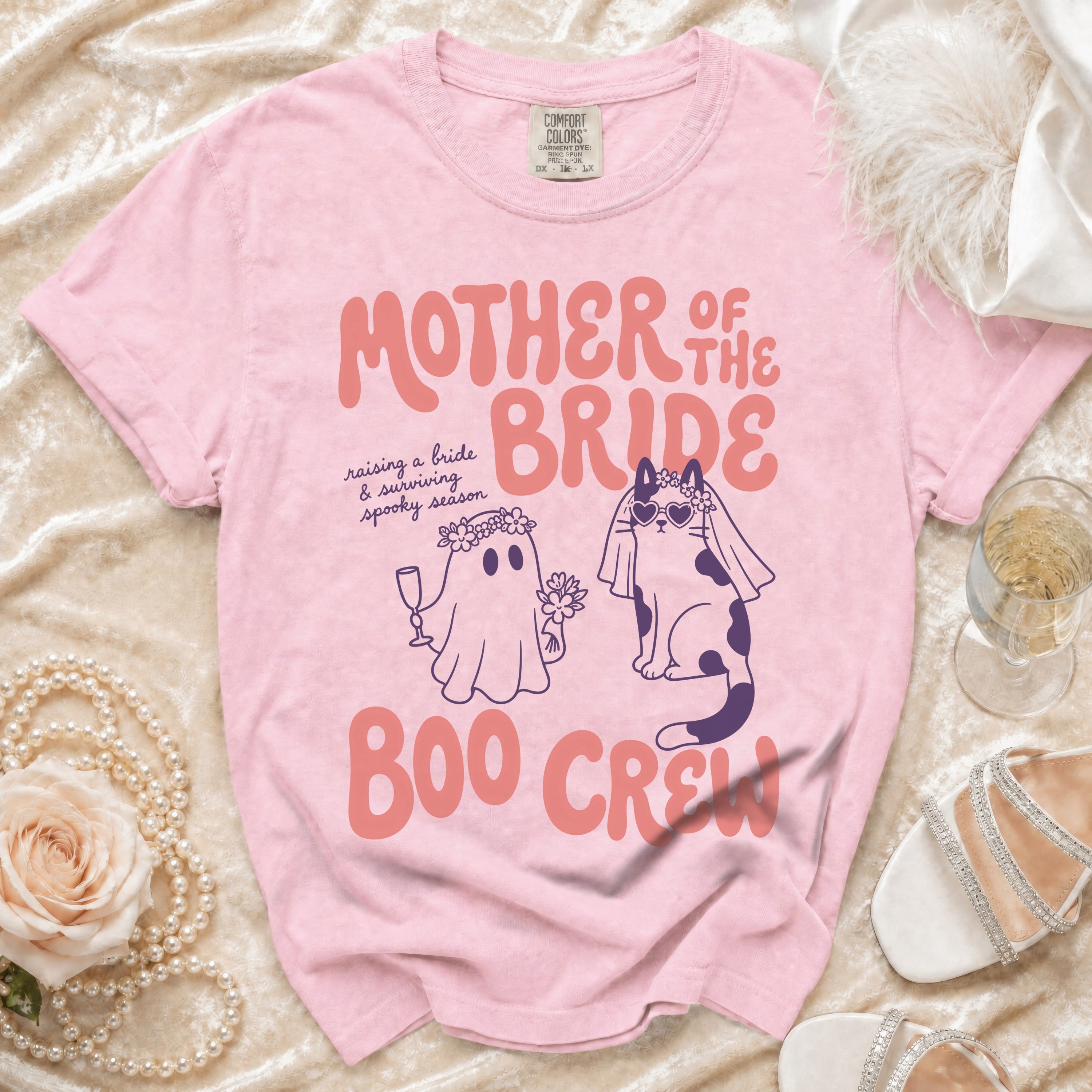 Pink t-shirt with "Mother of the Bride Boo Crew" graphic featuring a ghost and cat.