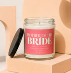 Vowed Mother of the Bride candle with a coral label.