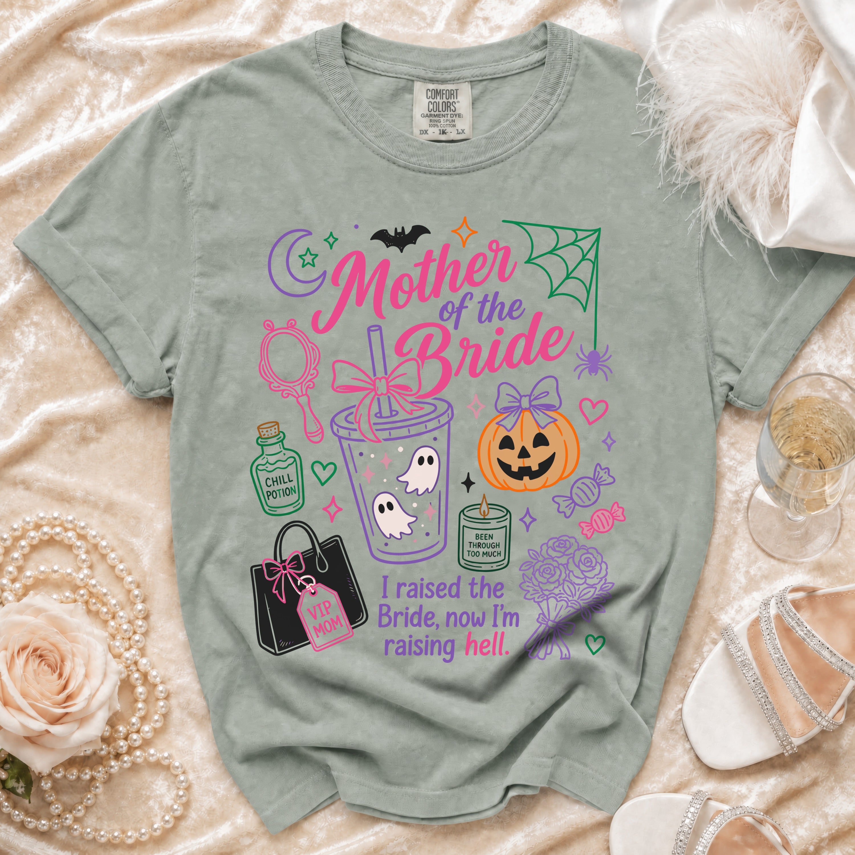 "Mother of the Bride" shirt with Halloween icons and text "I raised the Bride, now I'm raising hell."