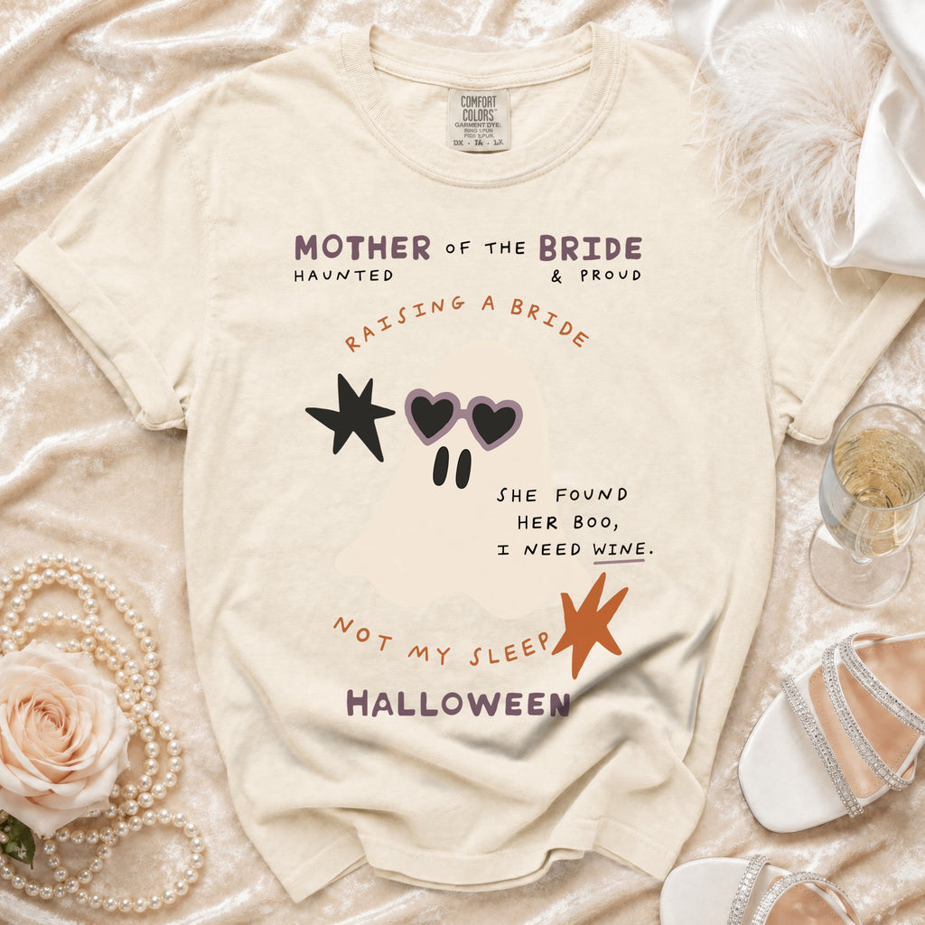Cream t-shirt with "Mother of the Bride Haunted & Proud" and ghost graphic.