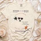 Cream t-shirt with "Mother of the Bride Haunted & Proud" and ghost graphic.