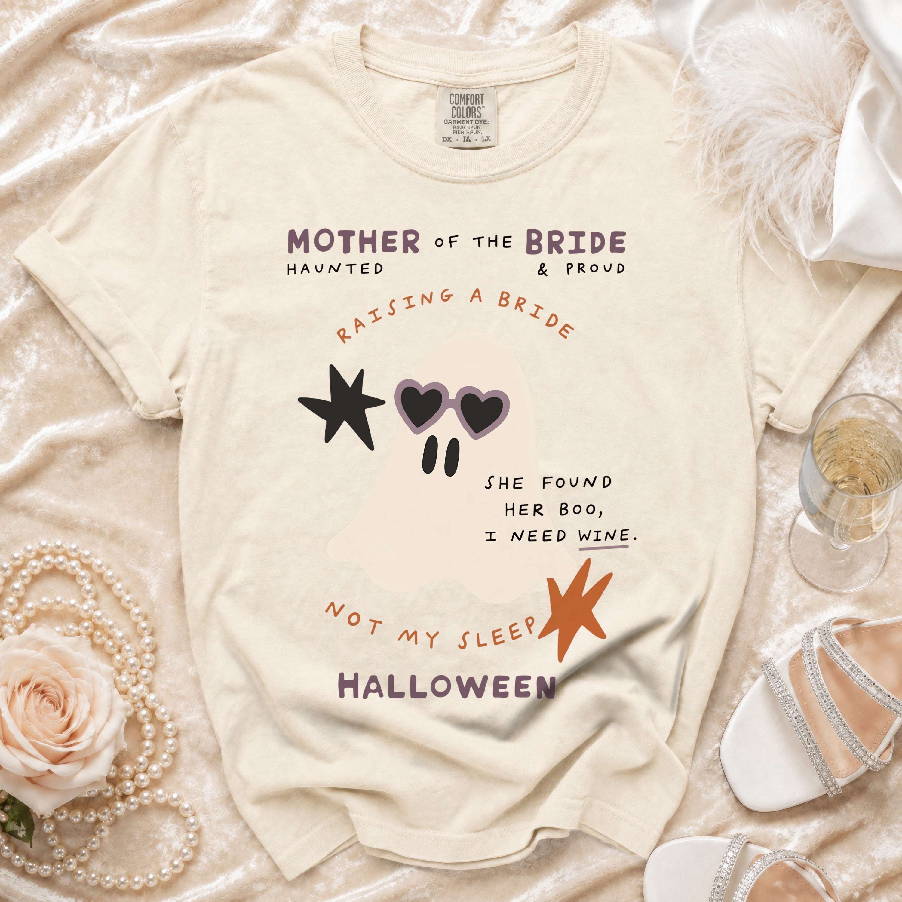 Cream t-shirt with "Mother of the Bride Haunted & Proud" and ghost graphic.