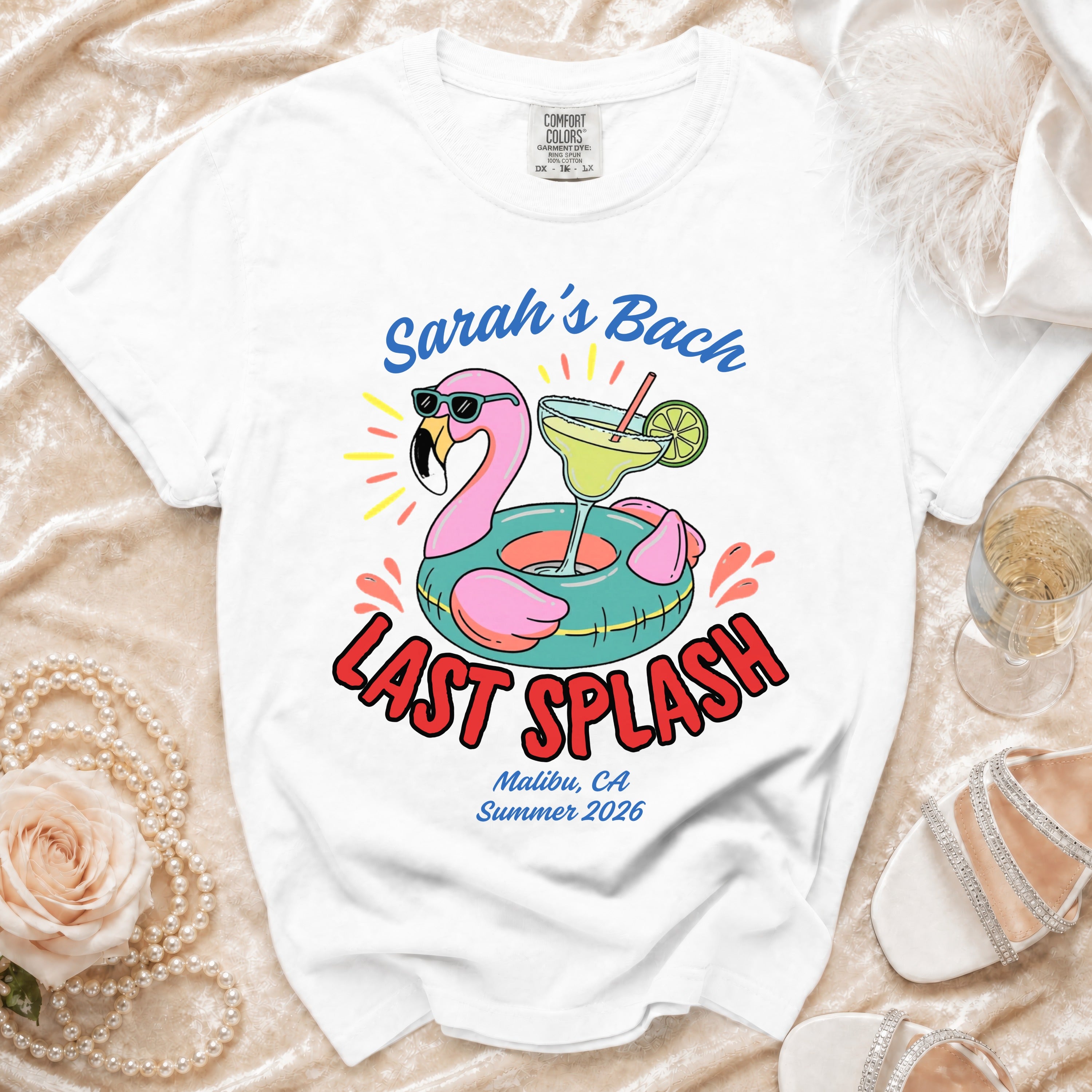 White t-shirt with "Sarah's Bach LAST SPLASH Malibu, CA Summer 2026" and flamingo graphic.
