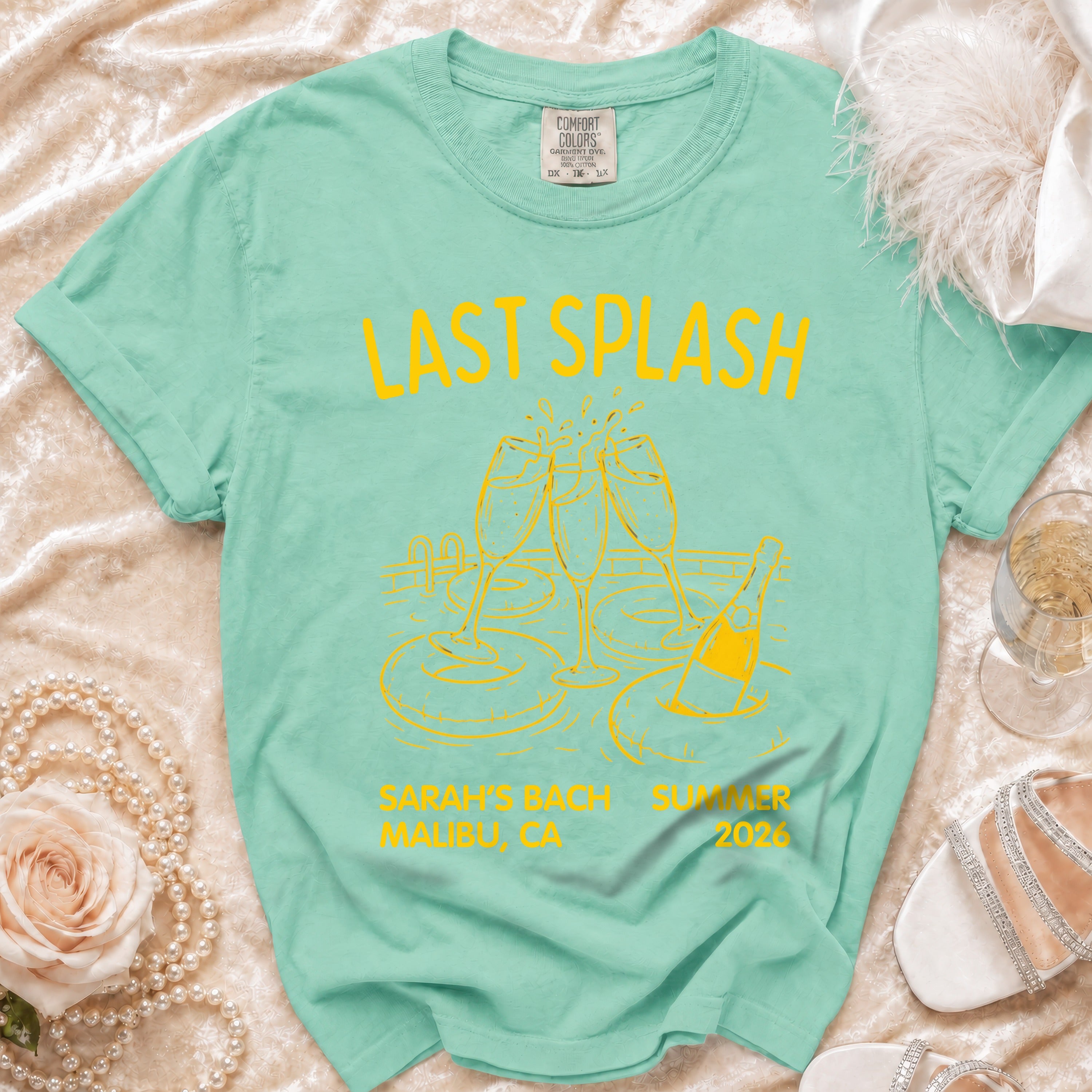 Mint green t-shirt with "Last Splash" and pool party graphics.