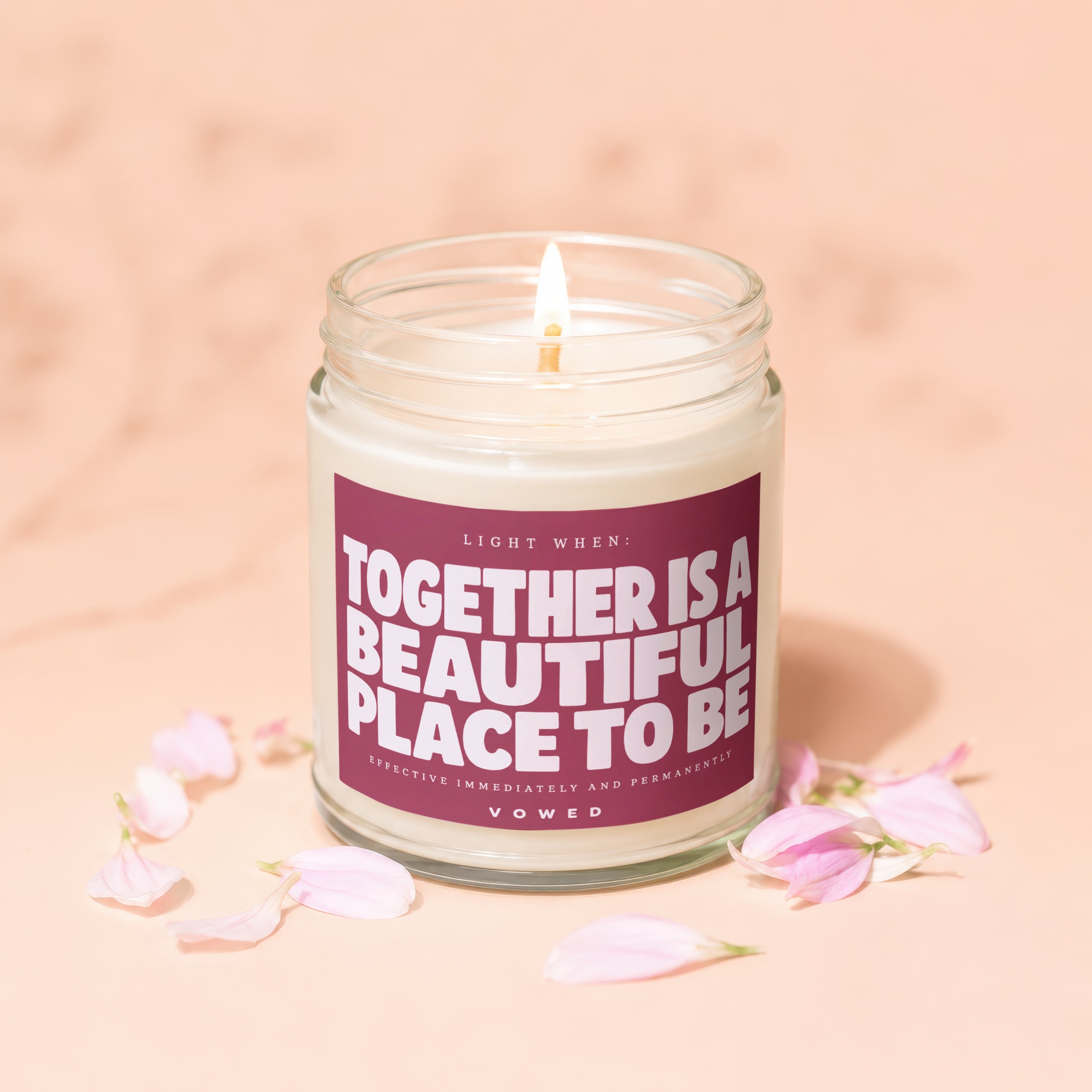 Candle with text "Together is a beautiful place to be" and "Vowed".
