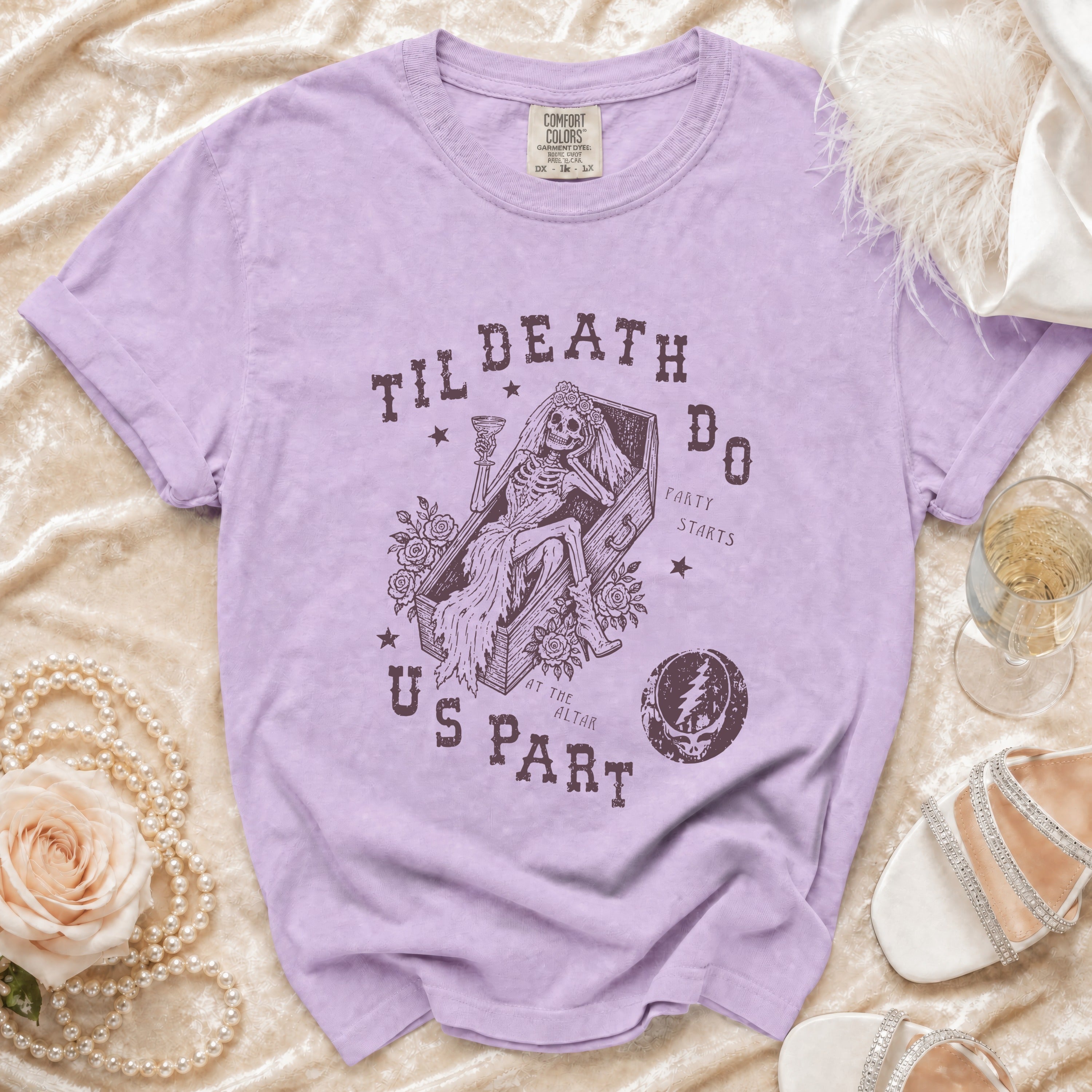 Purple t-shirt with skeleton bride graphic and text "Til Death Do Us Part".