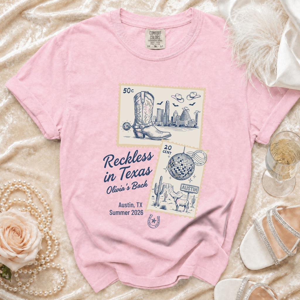 Pink t-shirt graphic with Texas-themed collage and "Reckless in Texas" text.
