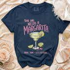 Navy t-shirt with "This Girl Needs a Margarita" and "Bride Tribe Let's Celebrate" text.