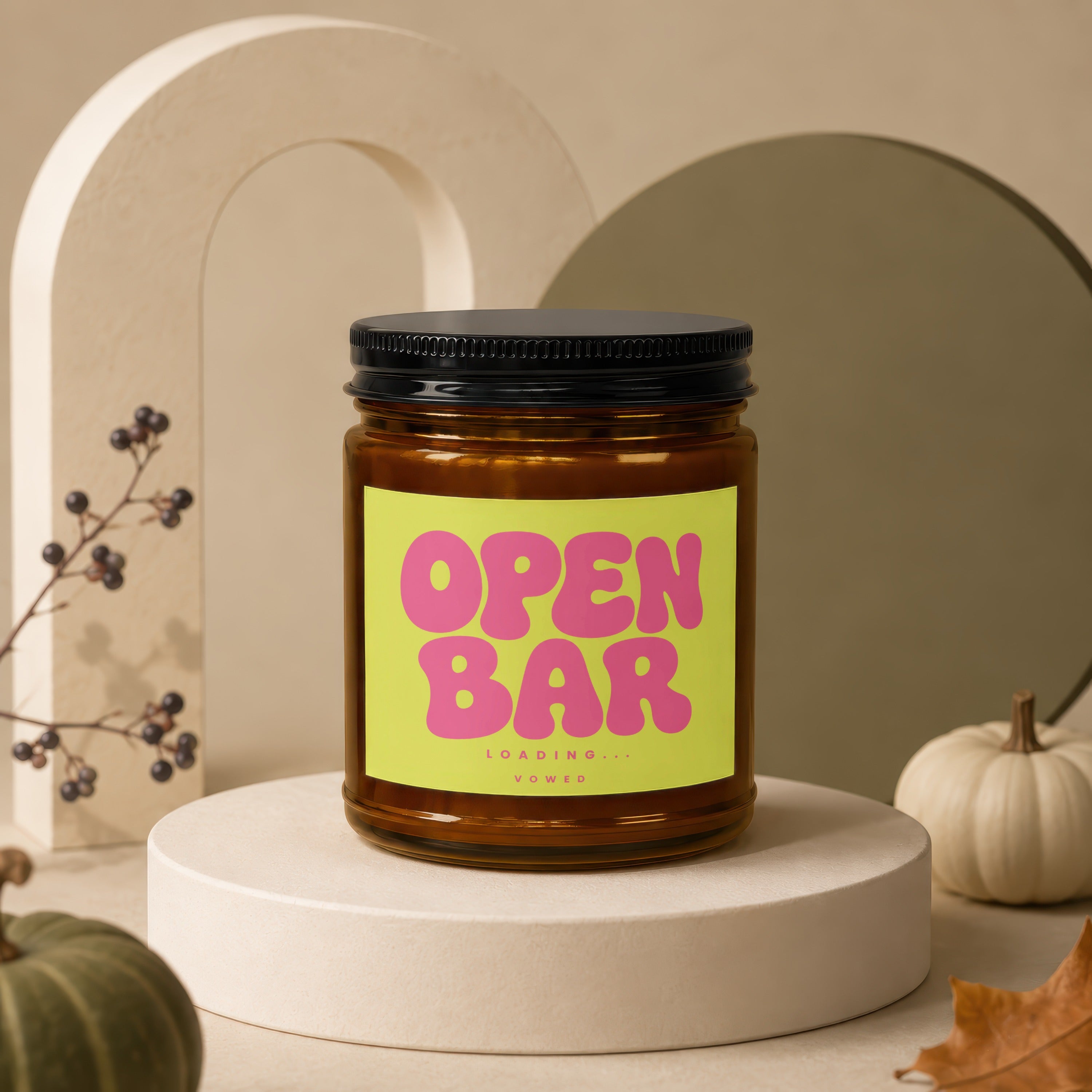 Amber jar candle with "OPEN BARLOADING... VOWED" on a lime green label.