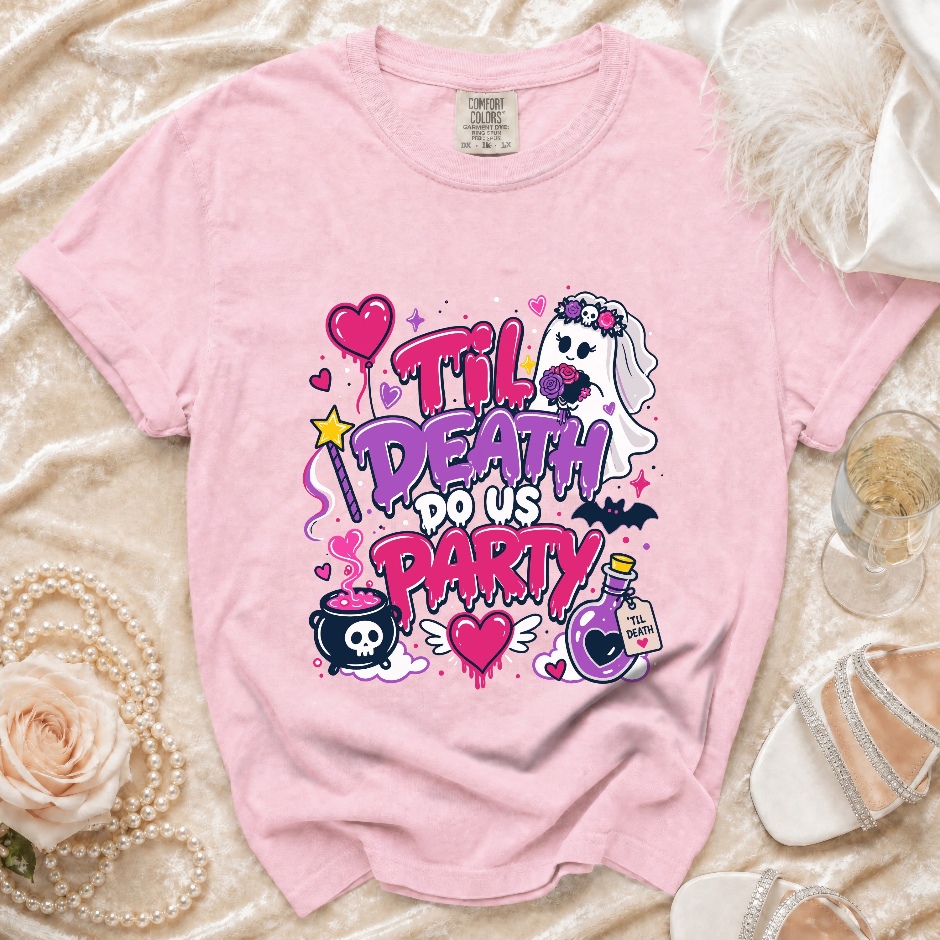 Pink t-shirt with "Til Death Do Us Party" graphic featuring a ghost bride and spooky elements.