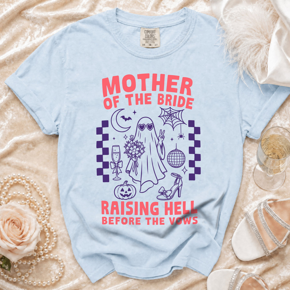 Light blue t-shirt with "Mother of the Bride Raising Hell Before the Vows" graphic.