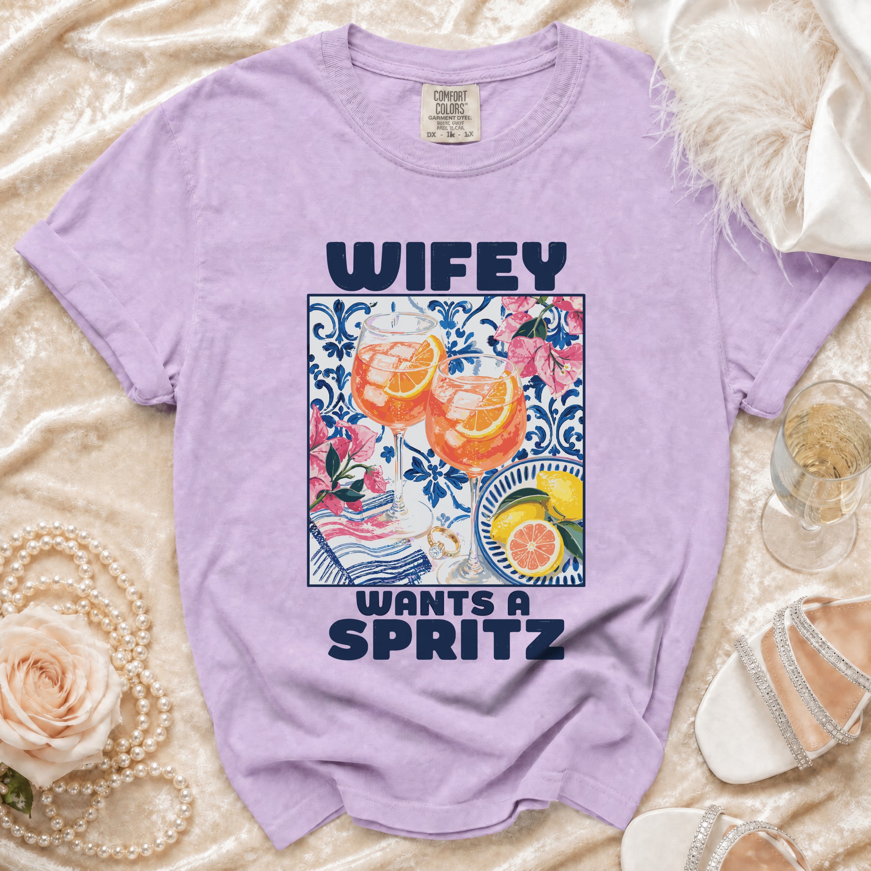 Purple t-shirt with text "Wifey Wants a Spritz" and cocktail graphic.