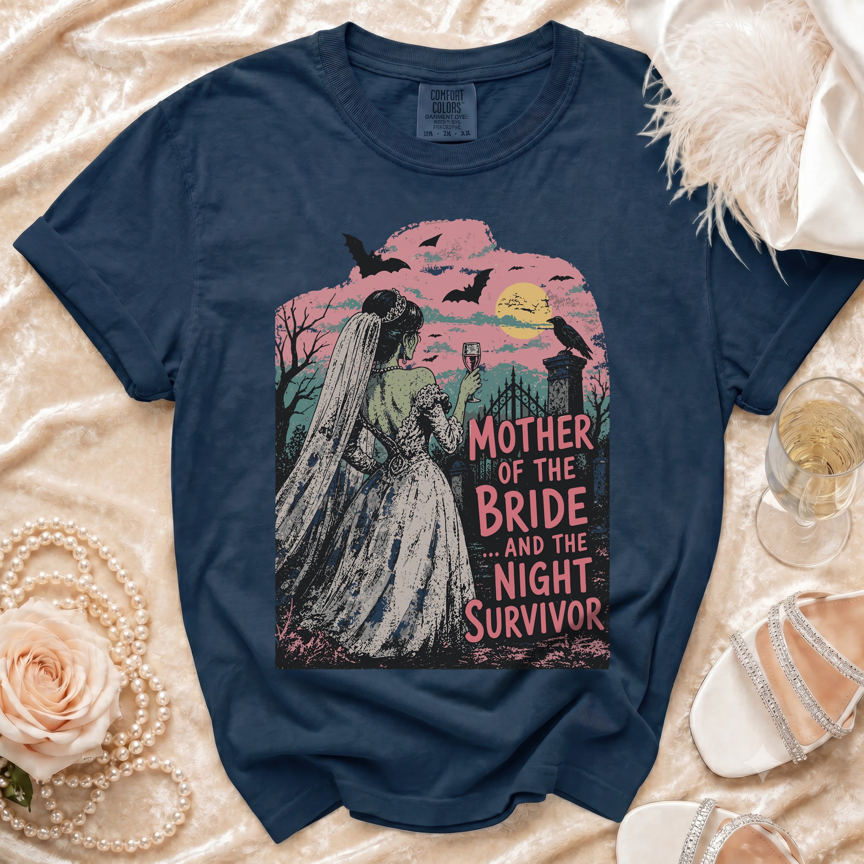 Dark blue t-shirt with "Mother of the Bride... and the Night Survivor" graphic.