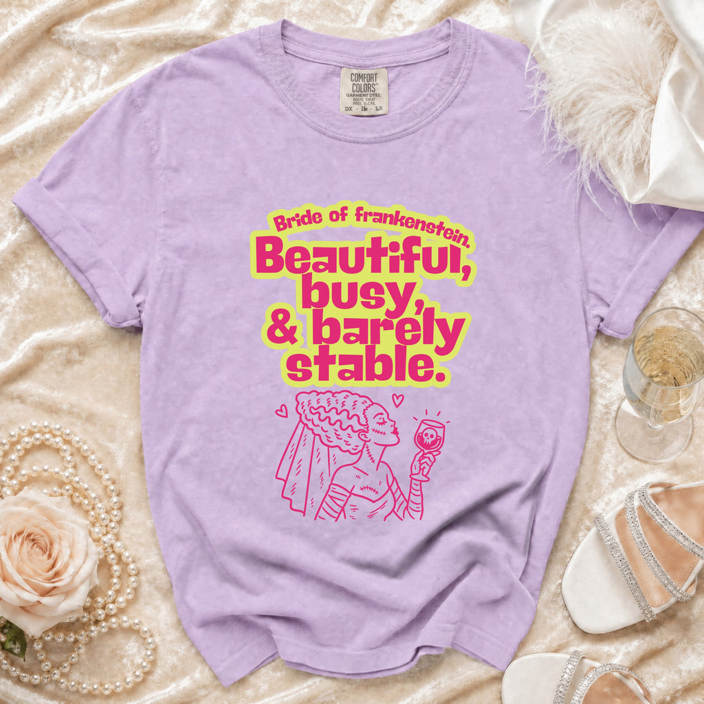 Purple t-shirt with "Bride of Frankenstein, Beautiful, busy, & barely stable" text and graphic.