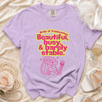 Purple t-shirt with "Bride of Frankenstein, Beautiful, busy, & barely stable" text and graphic.