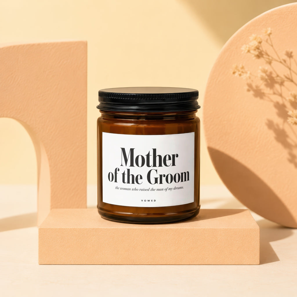 Amber glass candle with "Mother of the Groom" label in black ink.