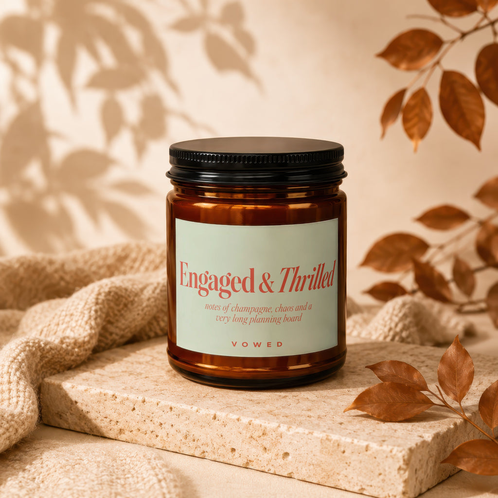 Brown jar candle labeled "Engaged & Thrilled" with scent notes.