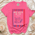 Pink t-shirt with "Red, White & I Do" text, cowboy boots, and fireworks.