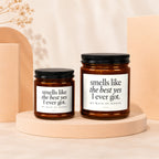 Two amber glass candles with black lids, labeled "smells like the best yes I ever got. MY MAID OF HONOR".