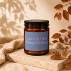 Candle with text "CAN'T DO THIS Without My Person" on a textured surface.