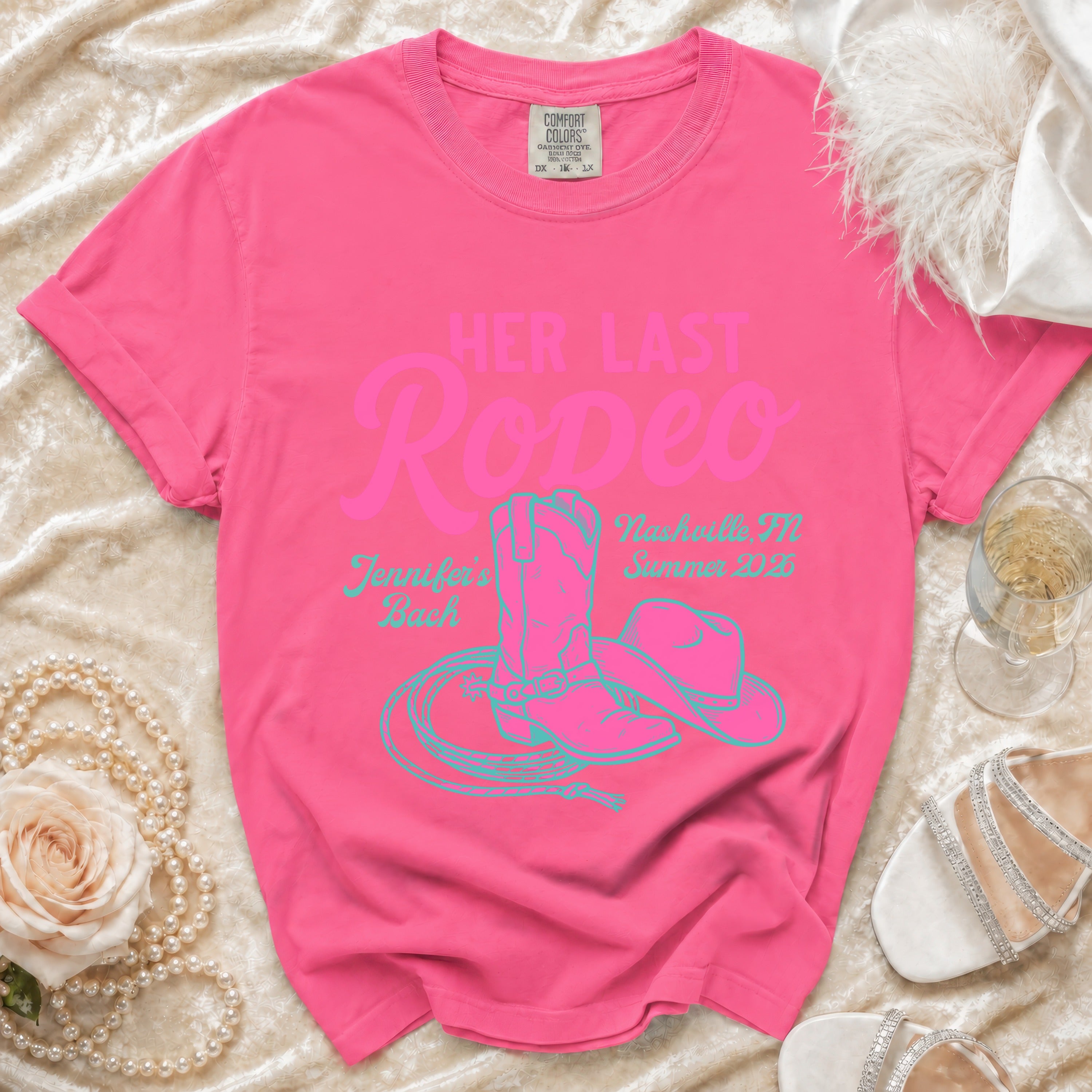 Pink t-shirt with "Her Last Rodeo" and cowboy boot and lasso design.