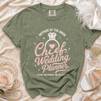 Green t-shirt with "Mother of the Bride Chief Wedding Planner" text and diamond ring graphic.