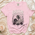 Pink t-shirt with "Bride After Dark" text and a skeleton bride graphic.