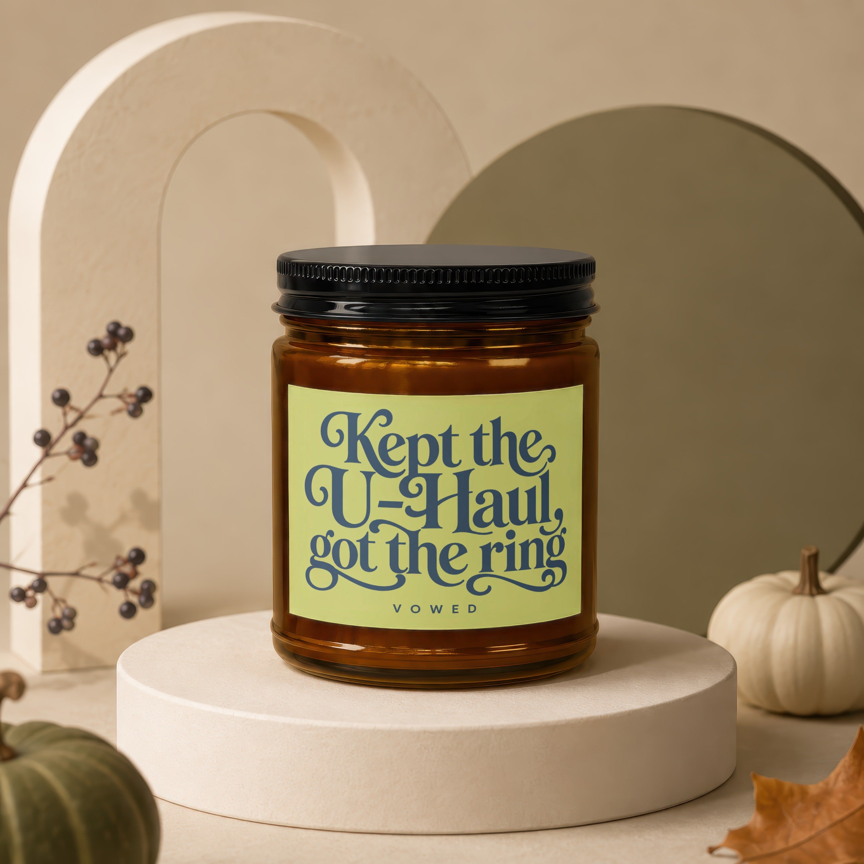 Glass candle with label reading "Kept the U-Haul, got the ring."