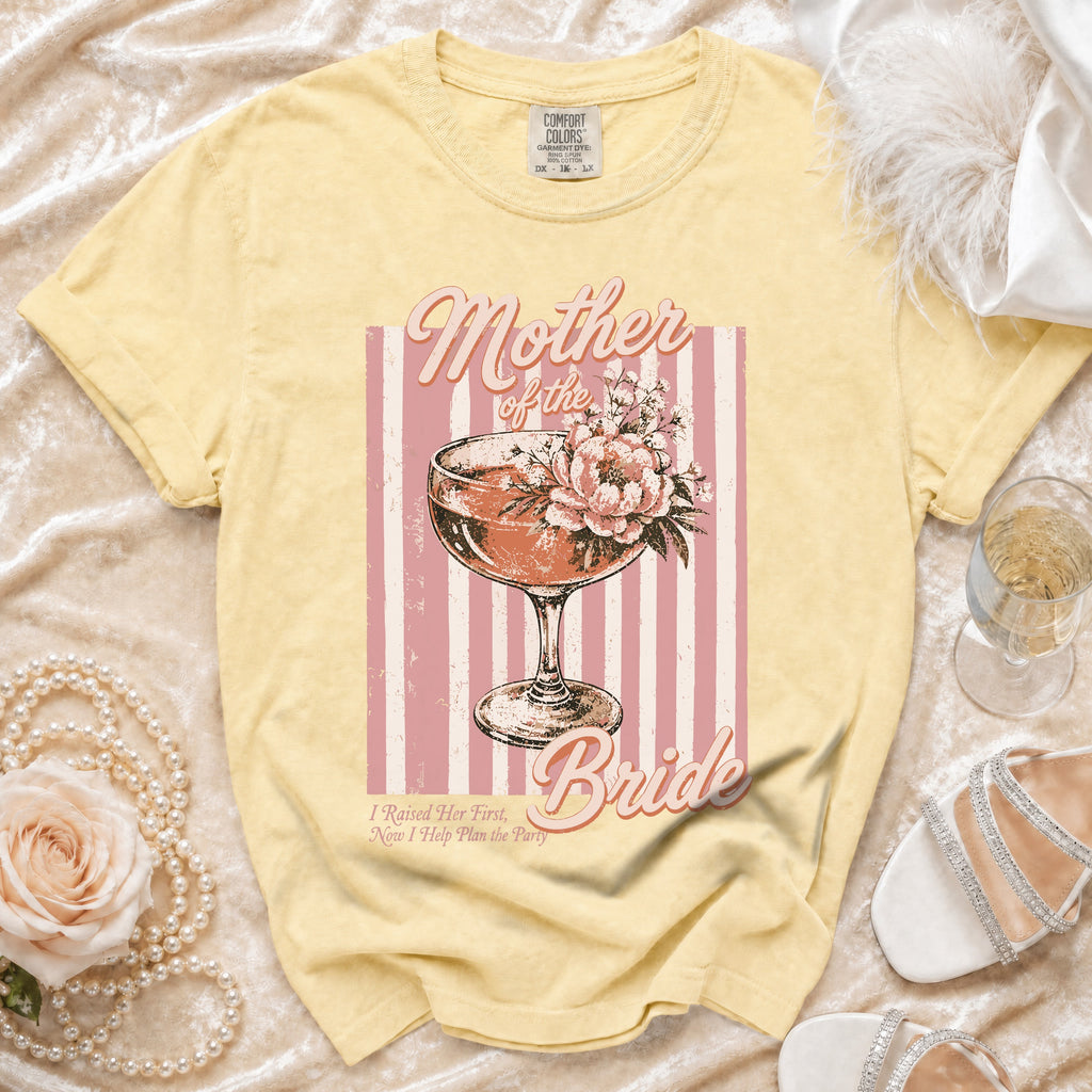 Yellow t-shirt with "Mother of the Bride" text and a cocktail glass graphic.