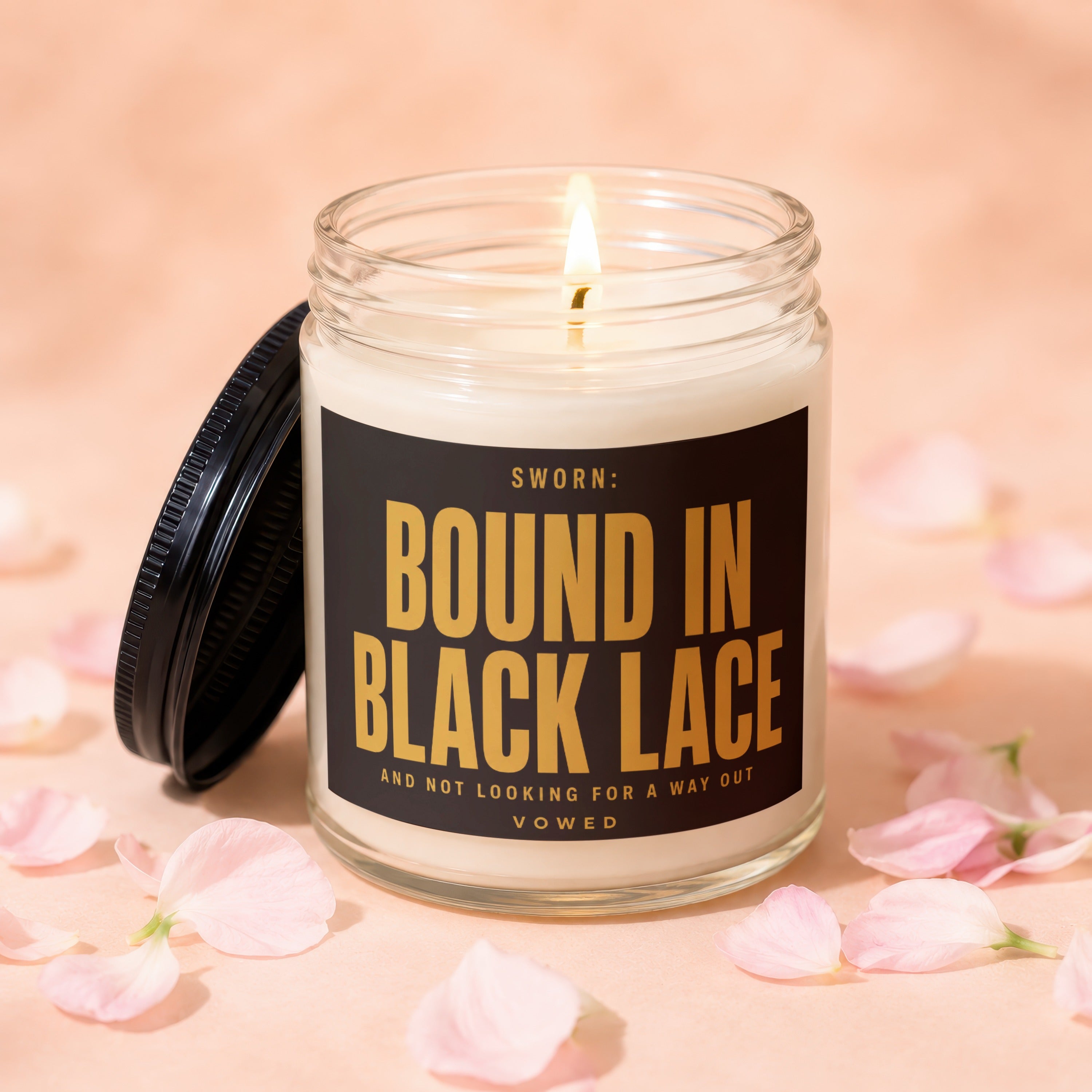 Candle with black lid and label reading "SWORN: BOUND IN BLACK LACE".