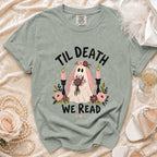 Ghost wearing veil, "Til Death We Read" text, surrounded by flowers and candles.
