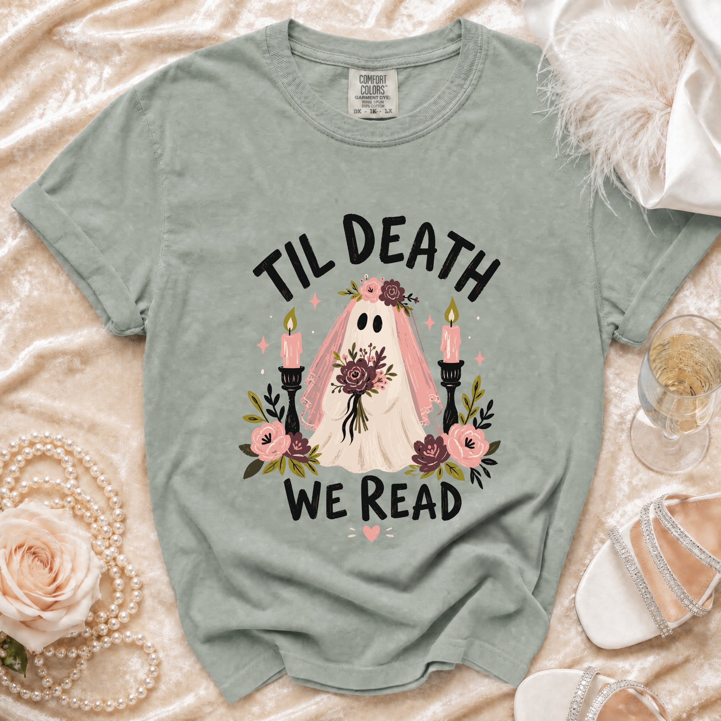 Ghost wearing veil, "Til Death We Read" text, surrounded by flowers and candles.