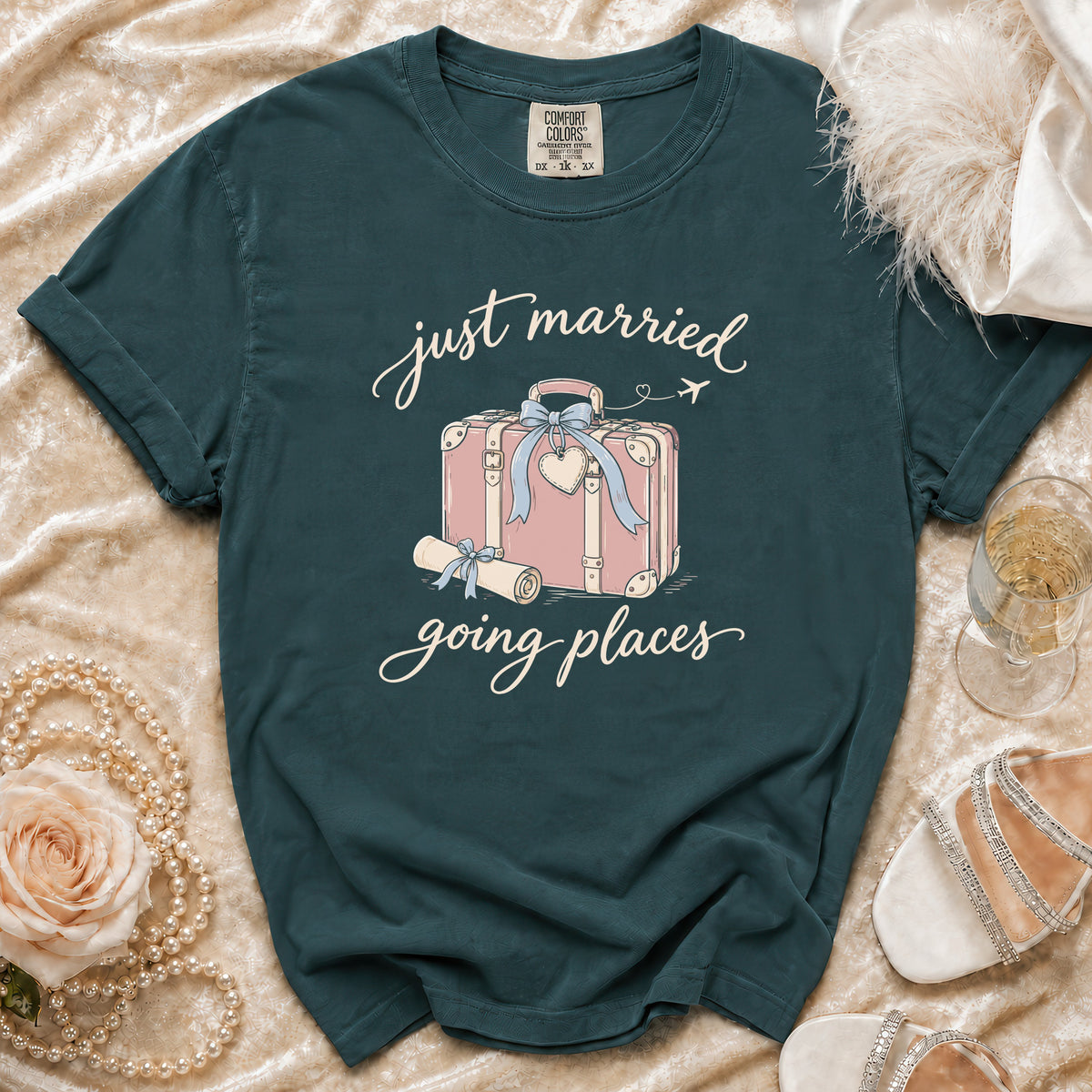 Teal t-shirt with "just married going places" graphic and suitcase illustration.