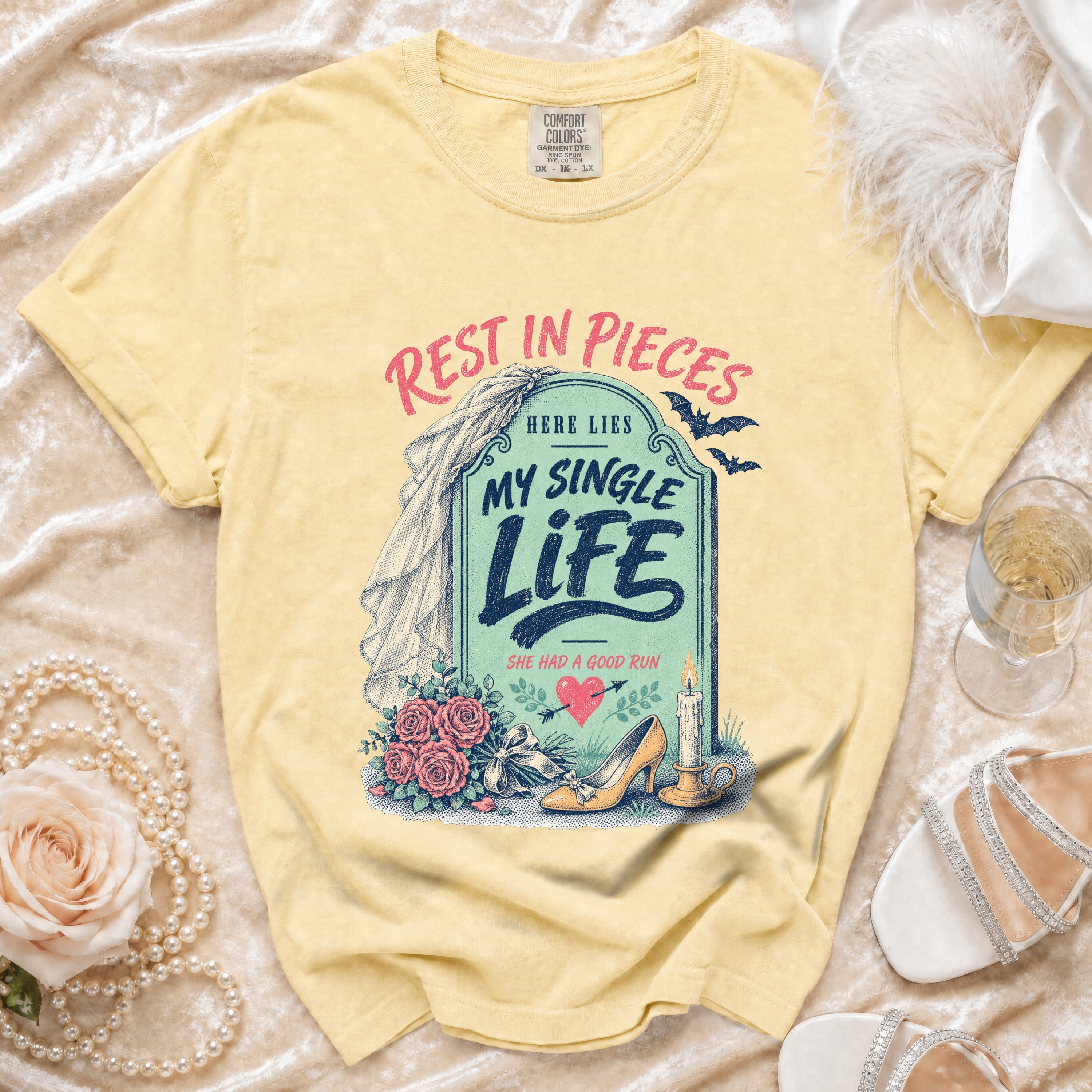 Yellow t-shirt with "Rest in Pieces My Single Life" tombstone graphic.